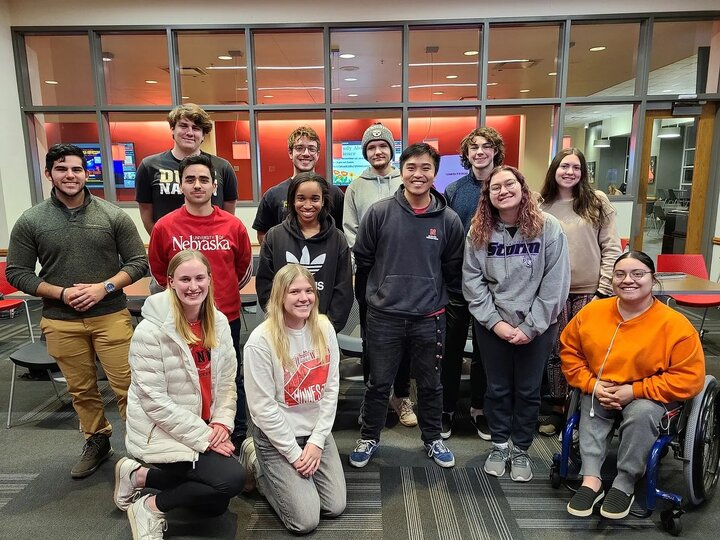 Group of 13 students posing for the photo