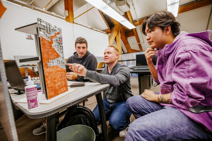 Assistant Professor Matthew Miller critiques student’s projects in the architecture design studio.