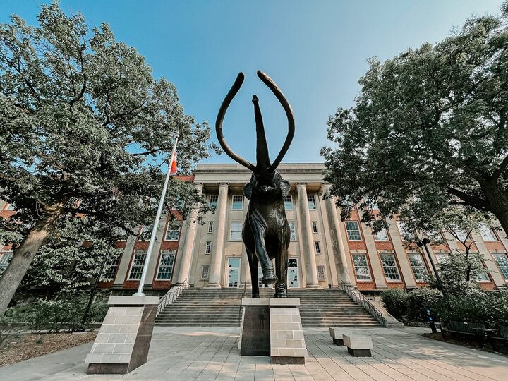 Archie the Mammoth stands tall outside Morrill Hall on a sunny summer day