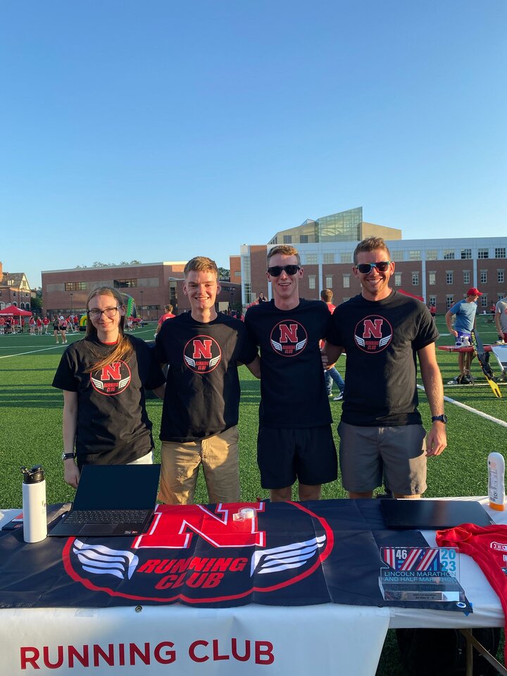 Tom takes a photo with fellow UNL Running Club members during the Club Fair