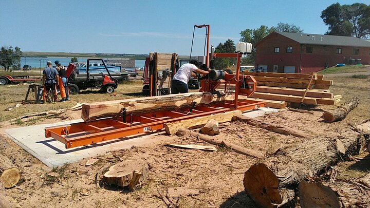 Chris processes wood from Eastern Red Cedar at Cedar Point Biological Station