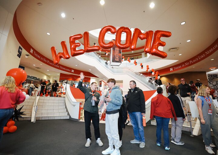 Admitted students and their parents walk under a welcoming balloon arch in the Nebraska Union and visit the different stations on Admitted Students Day.