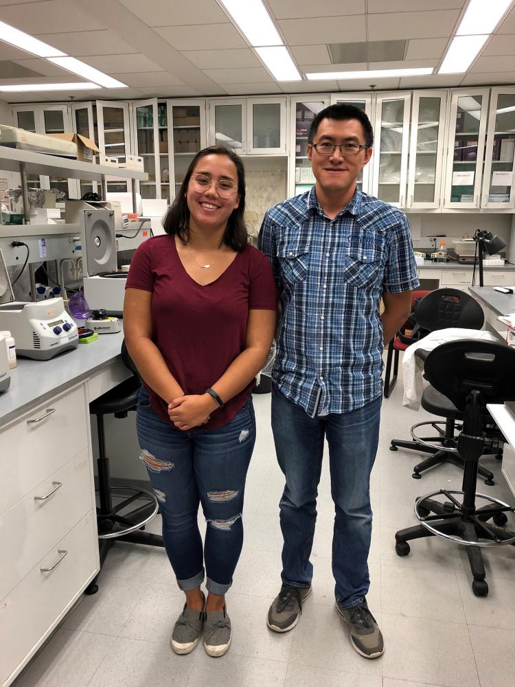 The 2019 REU student with her supervising postdoc in the lab.
