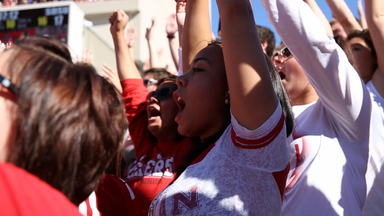 Students cheer at the football game