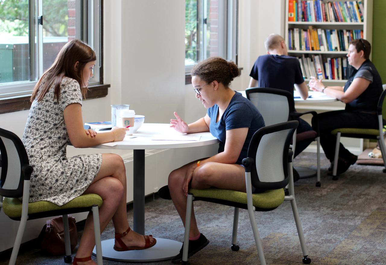 Students and writing consultants work together in the Writing Center